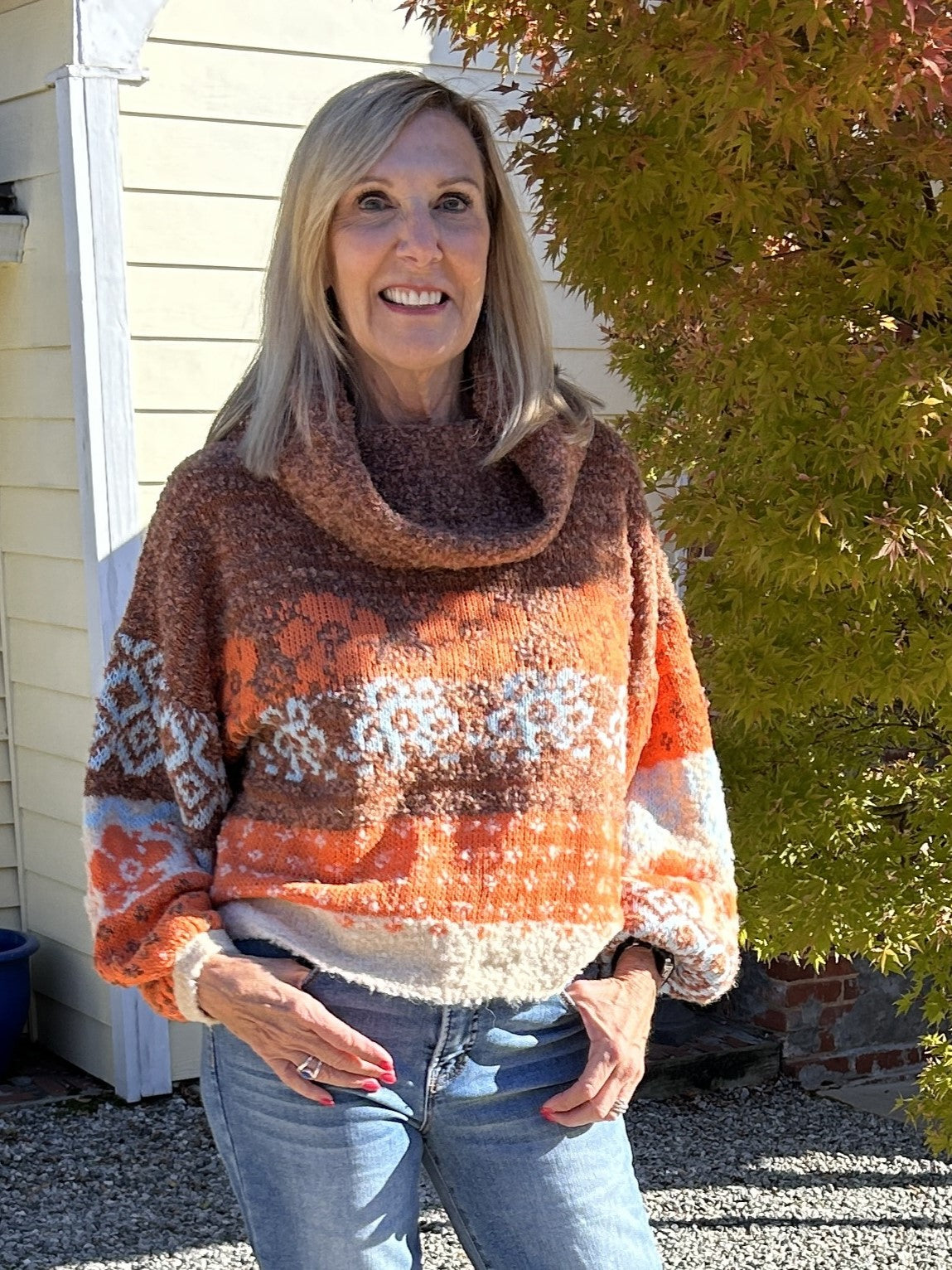 This cozy sweater with a floral pattern and turtle neck is perfect for fall. The warm colors of orange, cream, and brown, combined with the long sleeves and cuffs, make it ideal for outdoor fireside chats. Stay warm and stylish this season!

Material: 50% Acrylic / 30% Polyester / 10% Wool / 10% Nylon

Care Instructions: Hand wash separately in cold water, lay flat to dry