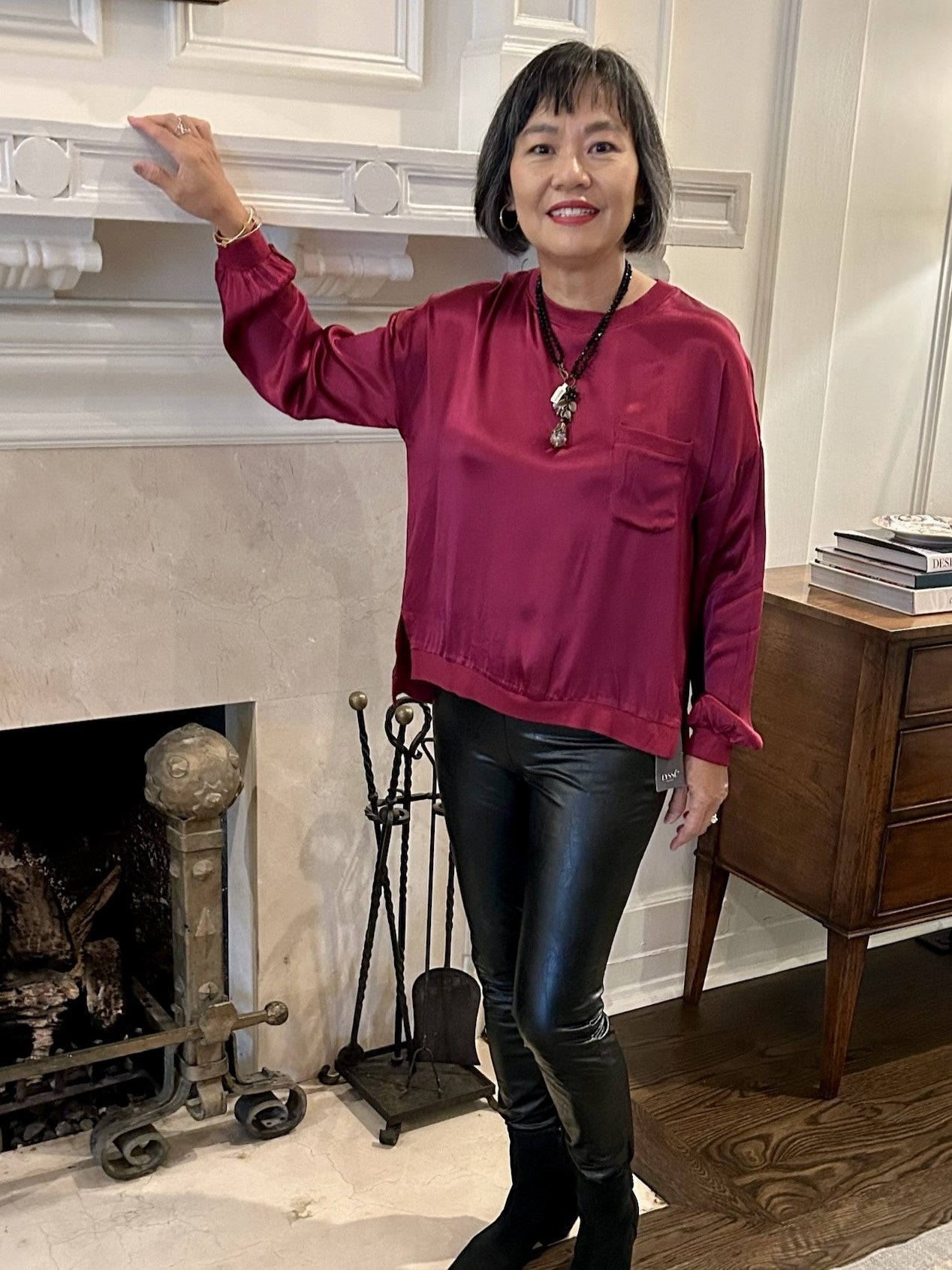 Enjoy your holiday gatherings in our Satin Round Neck Long Sleeve Top. The beautiful shimmer effect in maroon adds a touch of elegance. With a back zipper and ribbed neck, cuffs and waist, this top combines style and comfort.

Material: 50% Viscose / 50% Rayon; Contrast: 94% Rayon / 6% Spandex

Care Instructions: Hand wash separately, lay flat to dry