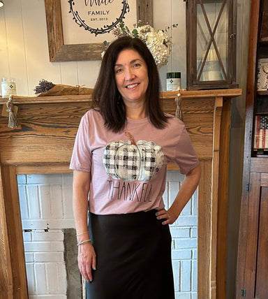 This super soft cotton tee will put you in the mood for Fall and Thanksgiving! Available in 3 colors and all have 'Thankful' printed under a black and white checked pumpkin. The olive and mauve colors are available in short sleeve and the burgundy color is available in long sleeve.