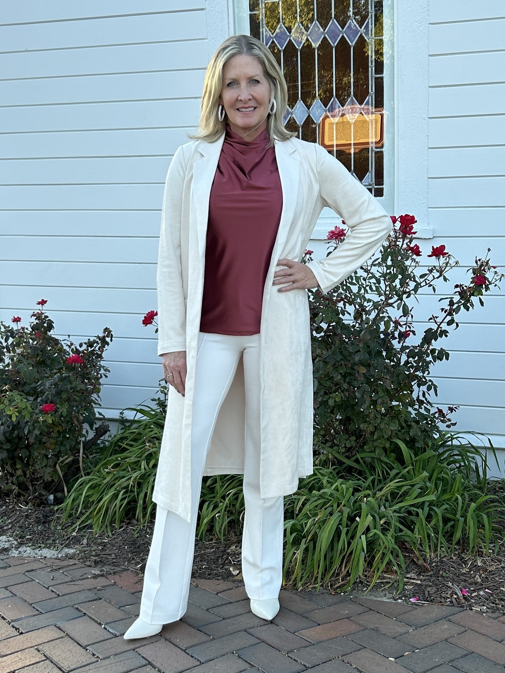 You will love our beautiful Faux Suede Duster/Coat! Experience a buttery soft feel while wearing this versatile piece. With slant pockets and side slits for easy movement, it's perfect for special occasions or everyday wear. Keep warm and stylish all season long with this must-have for fall and winter.

Paired with our "High Cowl Neck Blouse" and "Erin Wide Leg Denim/Pants".

Material: 92% Polyesters / 8% Spandex; Lining: 95% Polyesters / 5% Spandex

Care Instructions: Machine wash cold, hang to dry