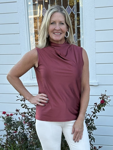 Discover effortless elegance with our Irina Satin Jersey Top in peony! Made with a wrinkle-free stretch satin jersey material, this sleeveless top features a flattering mock turtleneck and a front drape for added sophistication. Look stunning and feel comfortable all day long.

Stretch Satin- 77% Nylon, 23% Spandex
4-way stretch
Fitted

Care Instructions: Machine wash gentle, line dry