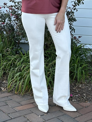 The Elysse Wide Leg Pant is a must-have for any wardrobe! With its front vertical stitching and concealed waistband, this lovely chalk/cream colored piece is perfect for year-round wear. Whether you're going for a casual or dressy look, it's sure to be an elegant addition to your closet!

Ponte- 67% Viscose, 28% Nylon, 5% Spandex
&nbsp;Lyssé concealed patented 360 smoothing waistband
4-way stretch
Skims hip and thigh; falls into fit-and-flare leg
33" Inseam
11" rise (size M)

Care Instructions: Machine was