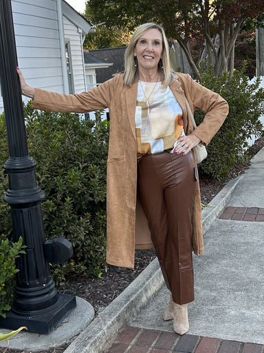 You will love our beautiful Faux Suede Duster/Coat! Experience a buttery soft feel while wearing this versatile piece. With slant pockets and side slits for easy movement, it's perfect for special occasions or everyday wear. Keep warm and stylish all season long with this must-have for fall and winter.

Paired with our "High Cowl Neck Blouse" and "Erin Wide Leg Denim/Pants".

Material: 92% Polyesters / 8% Spandex; Lining: 95% Polyesters / 5% Spandex

Care Instructions: Machine wash cold, hang to dry