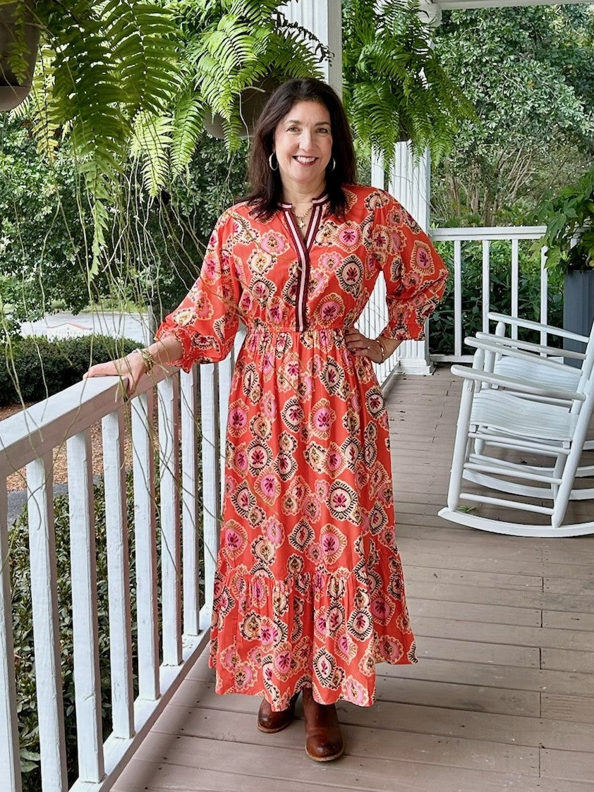 This Contrasting V-Neck Maxi Dress features a vibrant colorful pattern set against a warm orange background, enhanced by striking contrasting trim. The gathered waist flatters your silhouette, creating an elegant and comfortable fit perfect for any occasion.

Material: 100% Polyester; Lining:100% Cotton

Care Instructions: Hand wash cool, dry flat