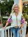 You will love our ruffled collar top featuring a cream background that highlights its stunning embroidered puffed sleeves. The vibrant Fall accent colors add a warm, seasonal touch, making it perfect for stylish autumn outings. Designed to blend classic charm with eye-catching details, this top effortlessly enhances your look with a unique, feminine flair.

Cindy is wearing a size Medium. She paired it with our "Risen High Rise-Wide Baggy Jeans in Dark". She accessorized with