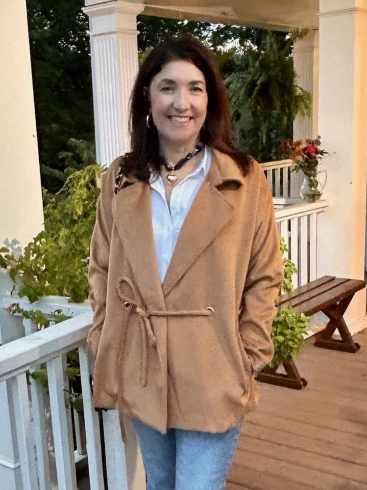 This camel-colored coat features a classic collar and a stylish tie waist, creating a flattering silhouette. Crafted from a very soft fabric, it offers both comfort and a luxurious feel. Its trendy short cut makes it a versatile piece that pairs effortlessly with any outfit, while the warm neutral tone ensures timeless elegance.

Material: 100% Polyester

Care Instructions: Hand wash on cold water, lay flat to dry