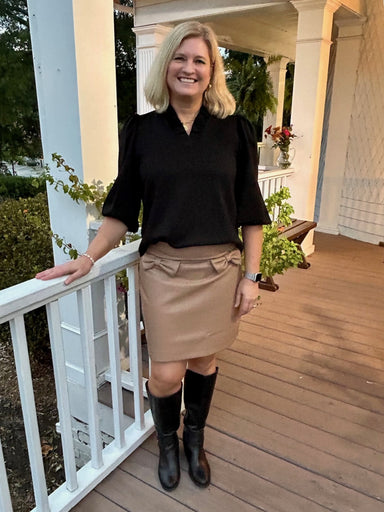 This faux leather short skirt in a versatile neutral beige offers a sleek, lined design for comfortable wear. Featuring playful bow detailing, it adds a touch of charm to any outfit. Perfect for dressing up or keeping it casual, this skirt easily adapts to your style needs.

Material: 55% Polyester / 45% Polyurethane

Care Instructions: Hand wash cold inside out, line dry