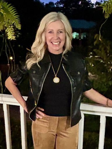 Best seller restock...We love everything about this black top/jacket! The faux leather fabric is amazing and the style is just too perfect! The sleeves have a ruffle at the elastic edge and a small puff at the shoulder. The banded waste makes it super flattering, zipped up as a top. It is also so cute as a jacket.&nbsp;

It runs true to size or a little roomy.&nbsp;

Material: 100% Polyurethane; Lining: 100% Polyester

Care Instructions: Hand wash in cold water, lay flat to dry