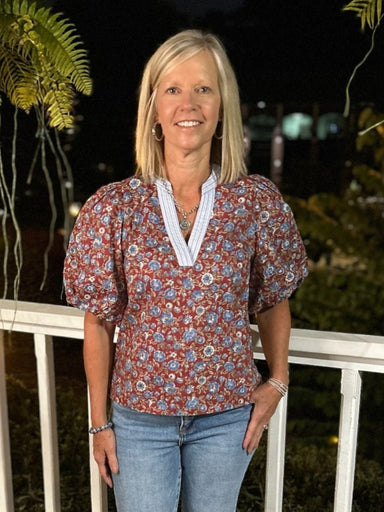 This Floral Print Puffed Sleeve Top features delicate puffed sleeves and a stylish contrasting placket that adds a playful touch. Crafted from lightweight fabric, it offers comfort and breathability, making it an ideal transition piece to effortlessly brighten your wardrobe across seasons. Perfect for adding feminine charm to any look.

Material: 100% Cotton

Care Instructions: Hand wash cold, line dry