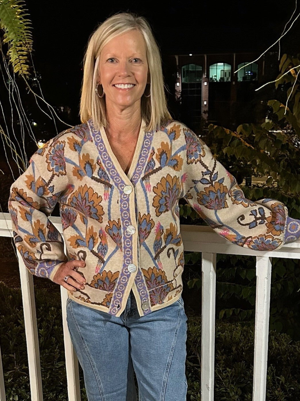 This versatile sweater transforms effortlessly—wear it buttoned up for a cozy fit or open like a cardigan for layered style. Featuring a beautiful floral design in warm, fall-inspired colors and a delicate border trim, it adds a soft, inviting touch to any outfit. Perfect for cooler days, its plush fabric promises comfort without sacrificing elegance.

Material: 36% Acrylic / 30% Nylon / 28% PBT / 6% Wool

Care Instructions: Hand wash separately in cold water, lay flat to dry