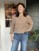 Stay stylish and comfortable with this Casual Crotched Long Sleeve Sweater! Featuring a beautiful mocha color, slight open weave fabric, drop shoulders, and a fit at the waist, this sweater is truly unique. Transition to the next season with effortless style and make a statement with this truly cute and casual piece. What's not to love?  Material: 70% Polyester / 30% Viscose  Care Instructions: Hand wash cold, line dry  Tara is wearing a size Small/Medium.