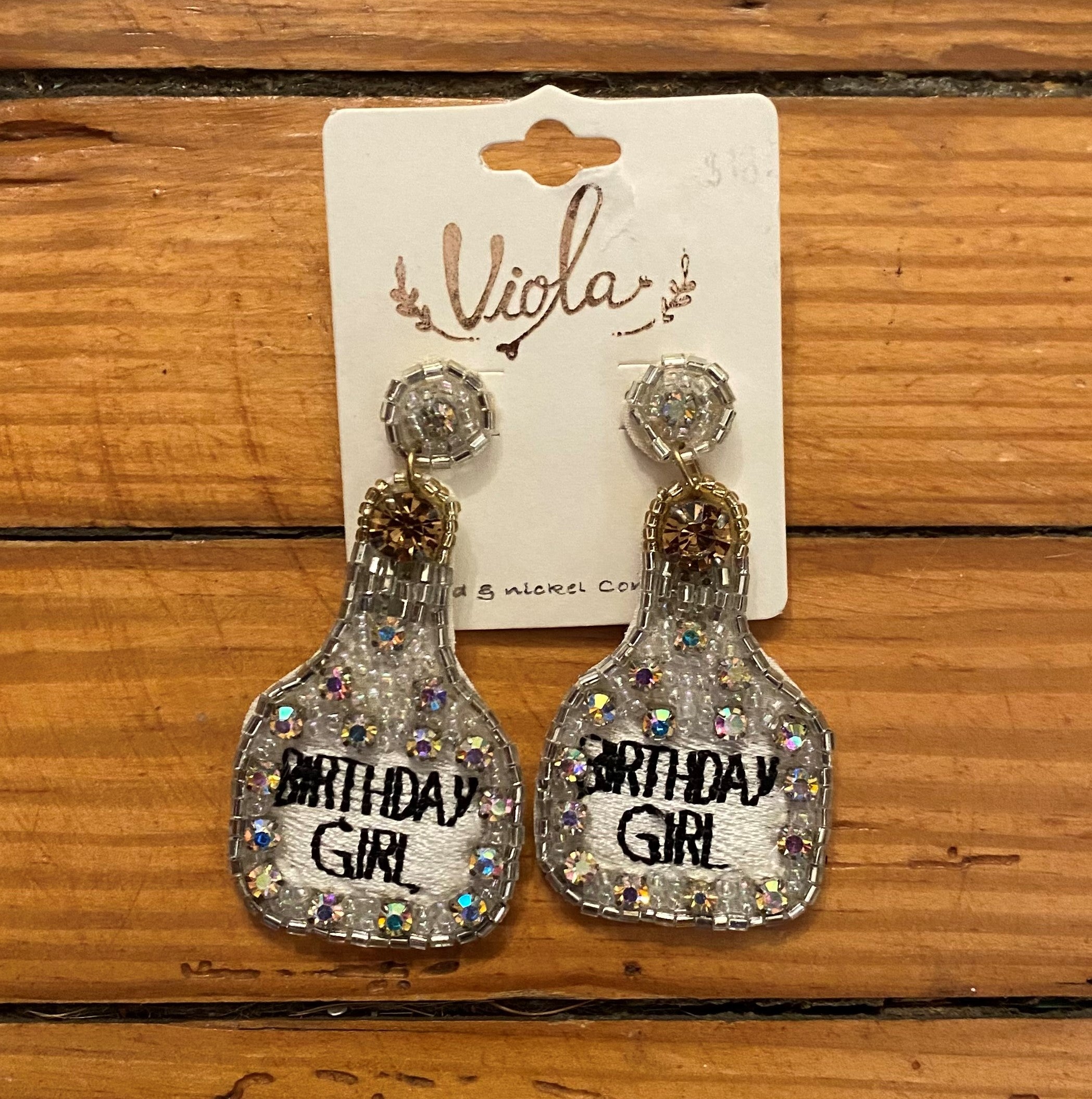 These "BIRTHDAY GIRL" beaded earrings are perfect for their special occasion. Crafted with silver beads and adorned with the words "Birthday Girl," these post earrings are the perfect touch for the birthday girl's special day!