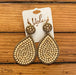 These beautiful earrings are crafted of antique gold and beige beads, making them an eye-catching accessory. The teardrop shape and ornate beading create an elegant and intricate design. Post earrings offer secure fastening.