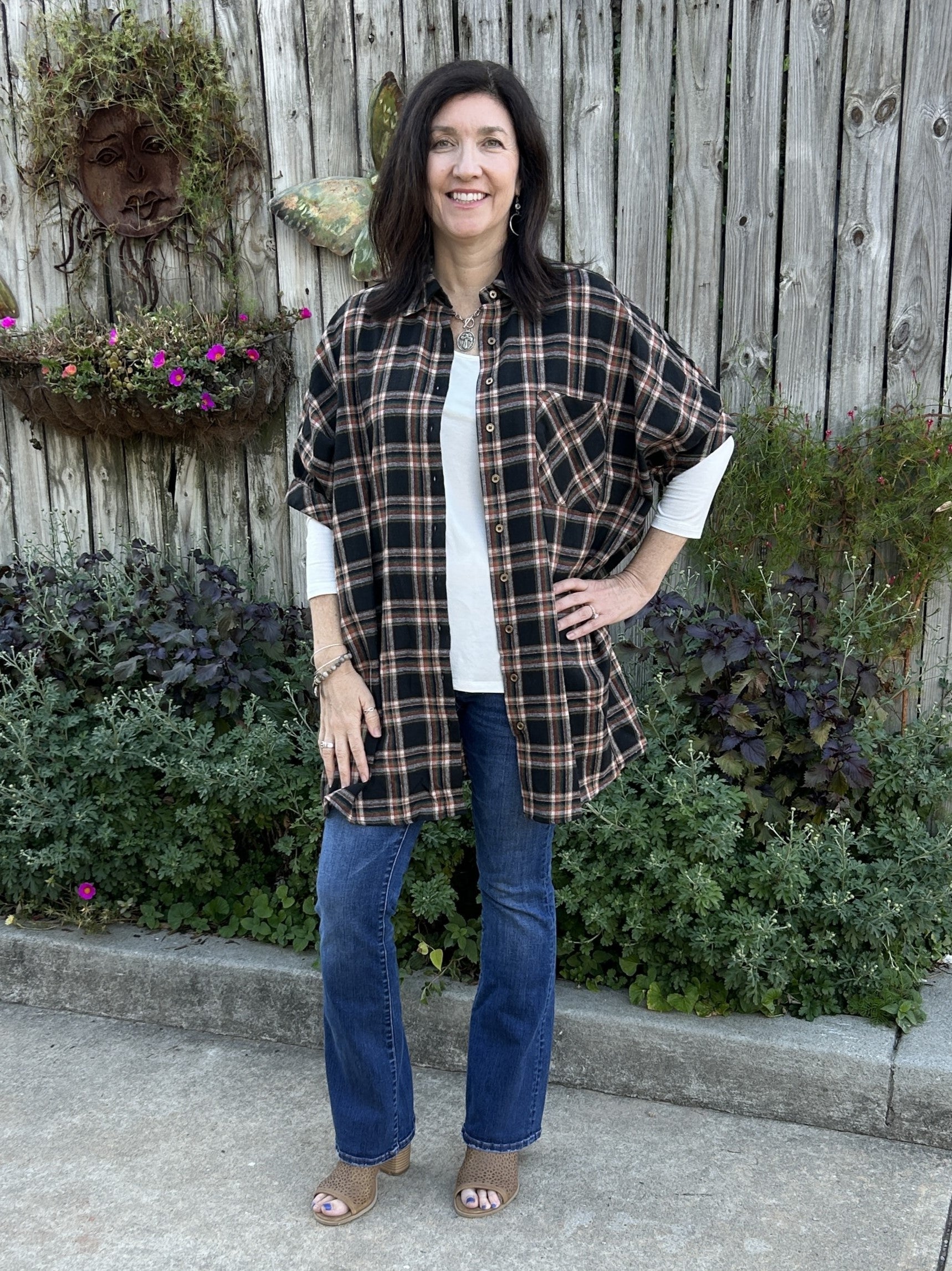 Stay stylish and comfortable in this chic Button Up Flannel Short Sleeve Dress/Shacket. With a flattering collared neckline, classic plaid design in black, rust, and beige, and off the shoulder cuffed short sleeves, it's sure to become an instant favorite. Wear is as is or paired with leggings or jeans. It's too cute!  Material: 60% Polyester / 40% Cotton  Care Instructions: Hand wash cold water , line dry