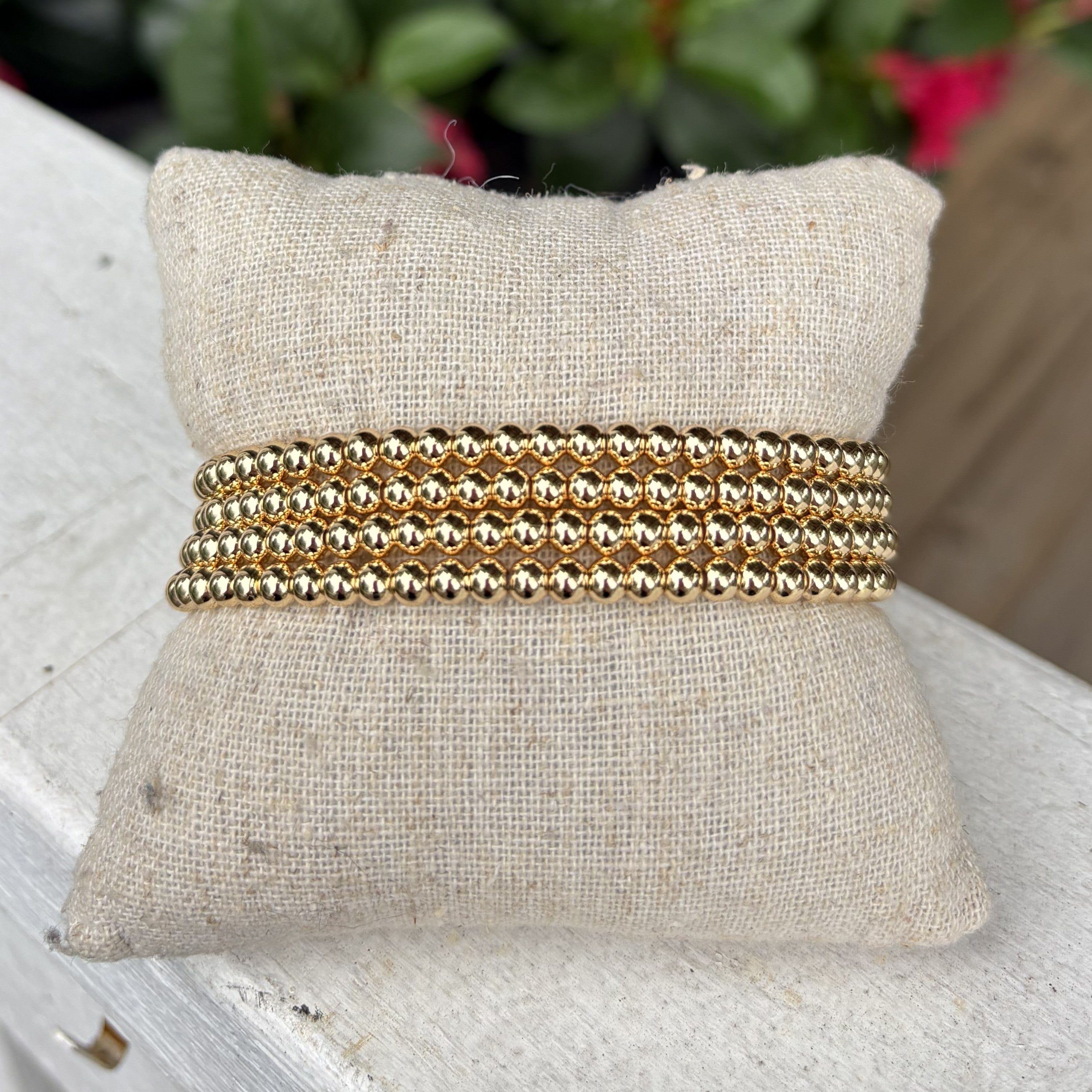 Update your everyday style with this versatile set of 4 beaded bracelets. Each stretch design slips on effortlessly and features timeless beading in both gold and silver finishes. Mix and match to create your perfect look—wear them individually for understated elegance or stack multiple bracelets for bold, layered impact. Simple, sophisticated, and endlessly customizable.