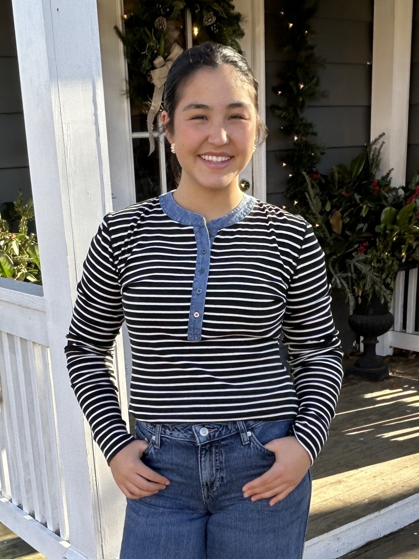 This versatile henley-style top combines timeless appeal with modern flair. The classic black and white stripe design pairs effortlessly with your favorite denim or black pants, making it a go-to piece for any occasion. Fun denim trim adds a playful touch that elevates the traditional button-down silhouette. Whether you're dressing up or keeping it casual, this two-tone essential delivers style and comfort in one chic package.

Material: 90% Cotton / 10% Polyester

Care Instructions: Hand wash separately in