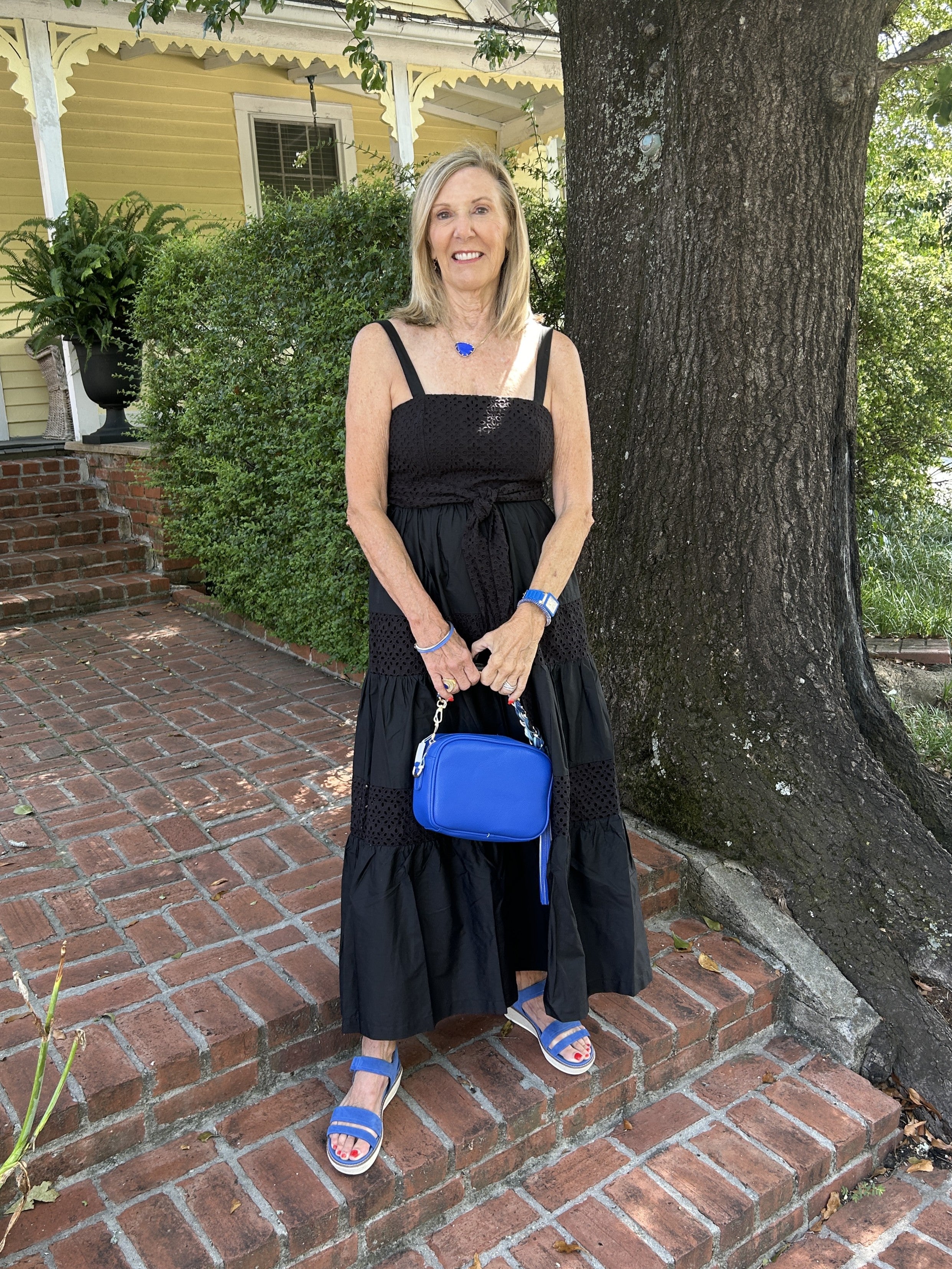 This stunning Contrasting Eyelet Maxi Dress features delicate black eyelet fabric and a flattering tiered skirt that moves gracefully with every step. Spaghetti straps and a waist tie enhance its feminine silhouette, making it an elegant choice for weddings, bridal showers, or a memorable night out.

Material: 100% Cotton; Lining: 100% Polyester

Care Instructions: Hand wash cold, hang dry