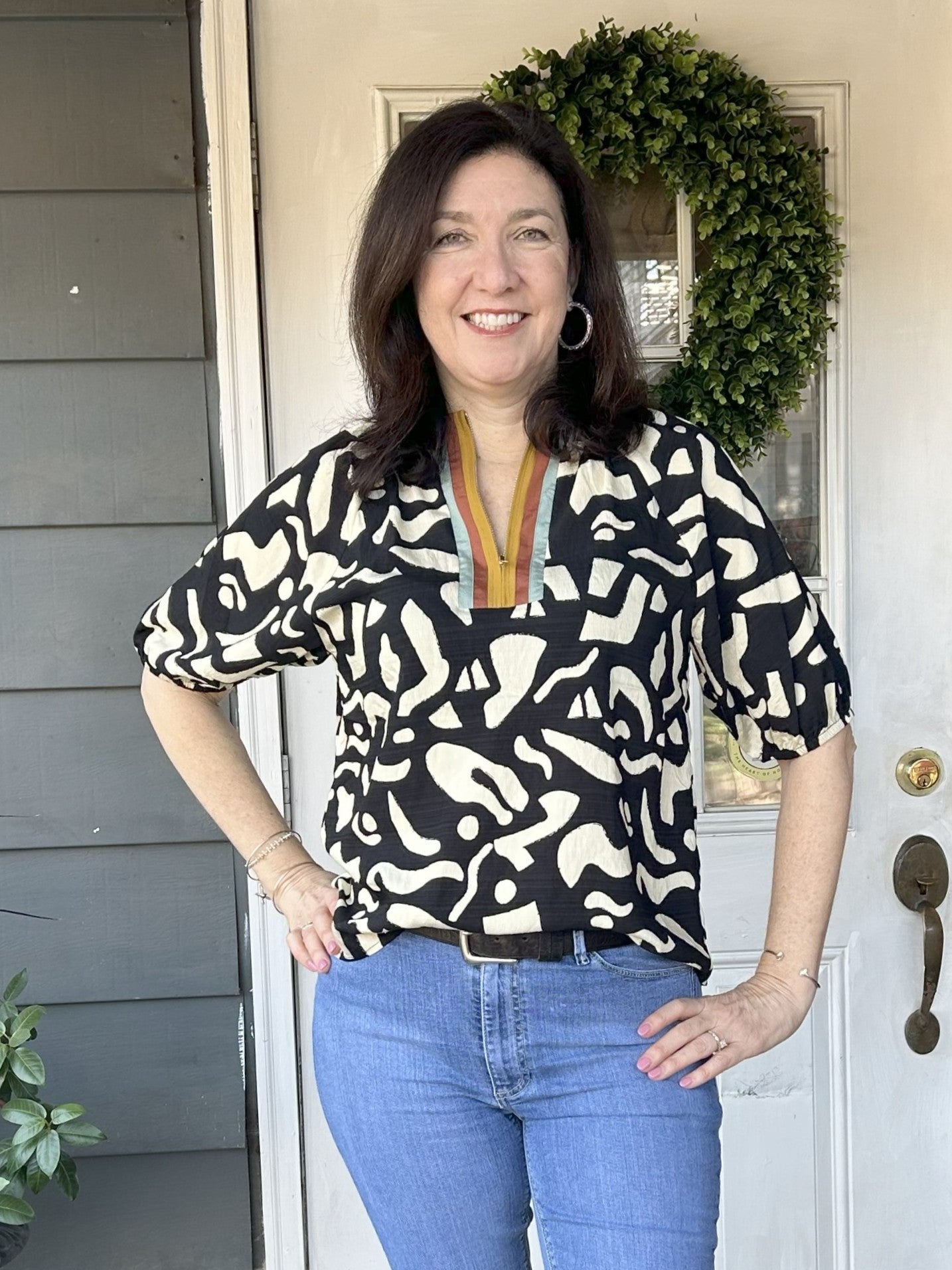 Start your fall style with this Short Sleeve Modern Design Top, featuring a striking front placket that draws attention. Its modern black and cream print offers a chic, versatile look, while the short sleeves with elastic cuffs provide comfort and a flattering fit.

Material: 83% Rayon / 17% Nylon

Care Instructions: Gentle cool hand wash, dry flat