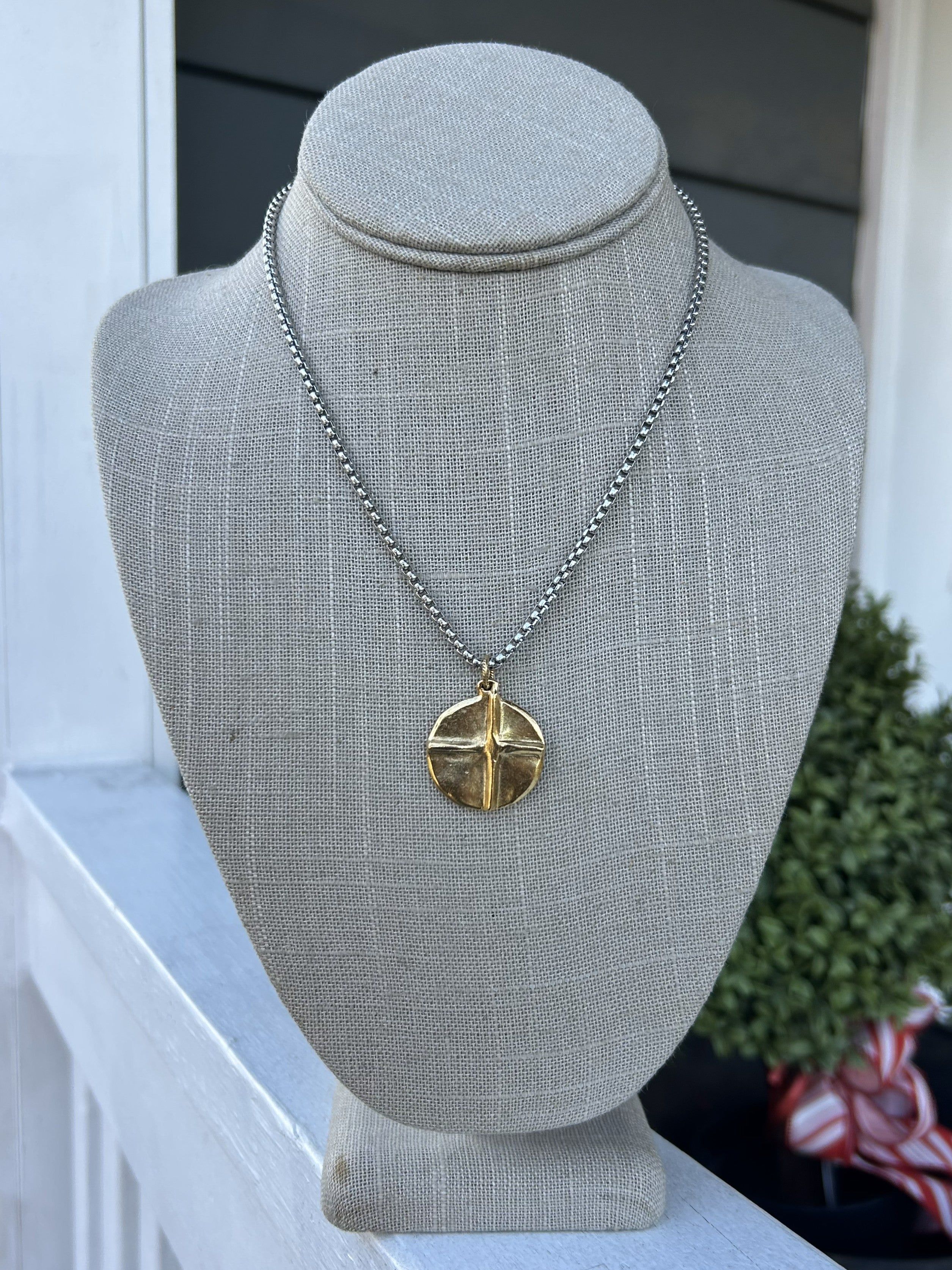 This versatile mixed metal necklace effortlessly transitions from casual to dressy occasions. One side features a delicate raised cross, while the reverse showcases a charming raised heart—giving you two meaningful designs in one piece. The thoughtful metal blend complements any wardrobe, making it the perfect everyday accessory that works with virtually everything you own. Layer it, wear it solo, or flip it to match your mood.