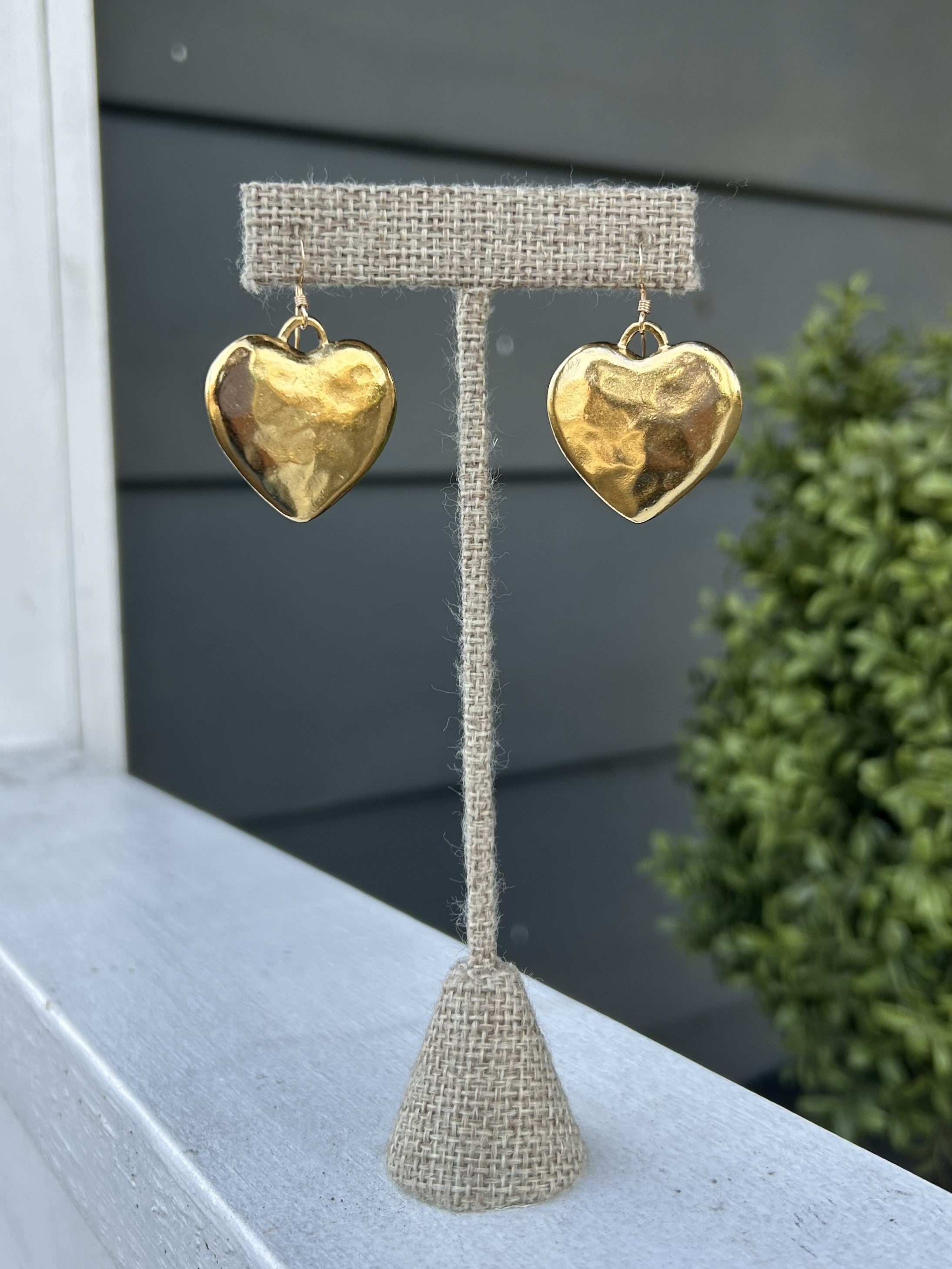 Add a touch of elegance to any outfit with our beautiful Hammered Heart Earrings. These versatile earrings are perfect for both dressy and casual occasions, making them a must-have in your jewelry collection. The unique hammered design adds a touch of texture and style!

The heart is approximately 1" x 1" in size.