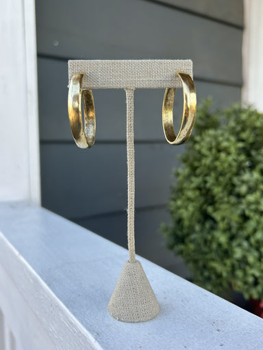 Make these Hammered Hoop Earrings your go-to accessory for every occasion. The artfully textured surface catches light with every movement, adding depth and character to your style. Whether you're dressing for a special event or keeping it casual, these hoops deliver the sophistication and versatility every jewelry collection needs.

1.25" Hoop