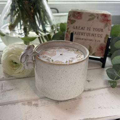 Discover the charm of our Peeking Bunny Candle, an 8 oz vessel in soft beige tones featuring an adorable bunny on the side. Infused with the delightful Pomelo Fizz fragrance, this beautiful container brings a playful touch to any room while filling your space with a fresh, citrusy aroma. Perfect for Easter, gifting or personal indulgence, this decorative candle combines whimsy with sophisticated style.&nbsp;