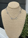 This refined short necklace showcases an elegant silver chain paired with distinctive equestrian boot charms that capture the spirit of horsemanship. The delicate design sits perfectly at the collarbone, making it an ideal accessory for riders, ranch enthusiasts, and anyone who loves western heritage. Wear it solo for subtle sophistication or layer it with other pieces for a personalized look.

Approximate Length: 15-17"

Note: Silver N' Accessories jewelry is brass and stainless steel with rhodium and 18 K