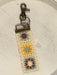 Keep your keys close and your style even closer with our adorable Crochet Key Fobs! Designed with convenience in mind, these key chains are perfect for carrying on your wrist while running errands. The clip and key ring make it easy to keep track of your essentials, while the embroidered designs add a playful and festive touch.

Details:

Loop fits comfortably around your wrist. Features antiqued brass key ring and lobster clasp to easily clip to your bag or belt loop
Cotton, metal