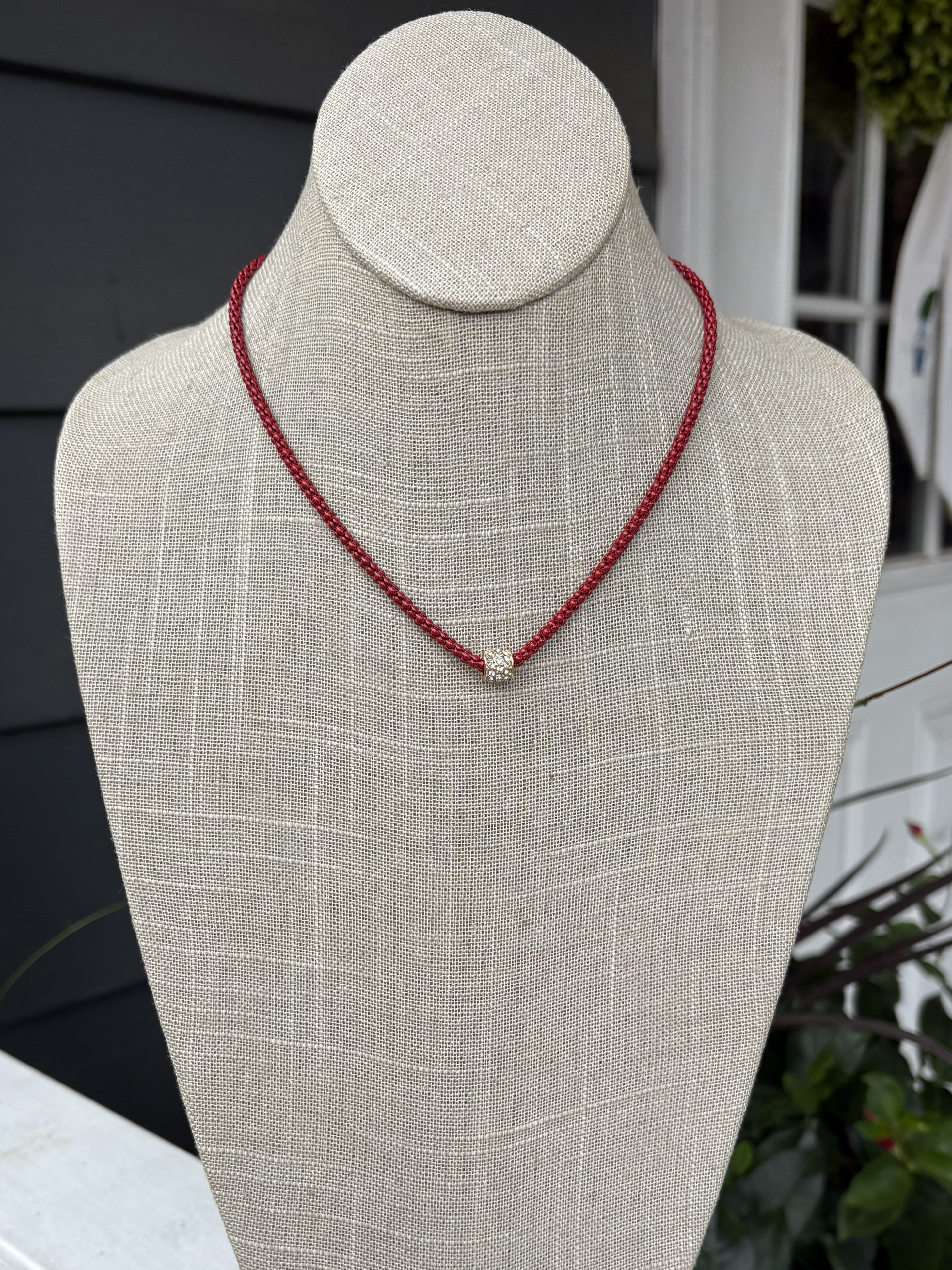 Cheer in confidence with the Cassie Game Day Necklace. This short, striking piece features a rhinestone tube charm. Perfect for game day enthusiasts, it pairs effortlessly with team colors and casual wear alike. Lightweight, eye-catching, and designed to be your go-to accessory for every victory lap.