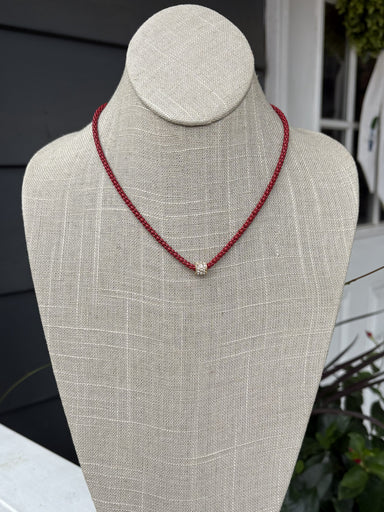 Cheer in confidence with the Cassie Game Day Necklace. This short, striking piece features a rhinestone tube charm. Perfect for game day enthusiasts, it pairs effortlessly with team colors and casual wear alike. Lightweight, eye-catching, and designed to be your go-to accessory for every victory lap.