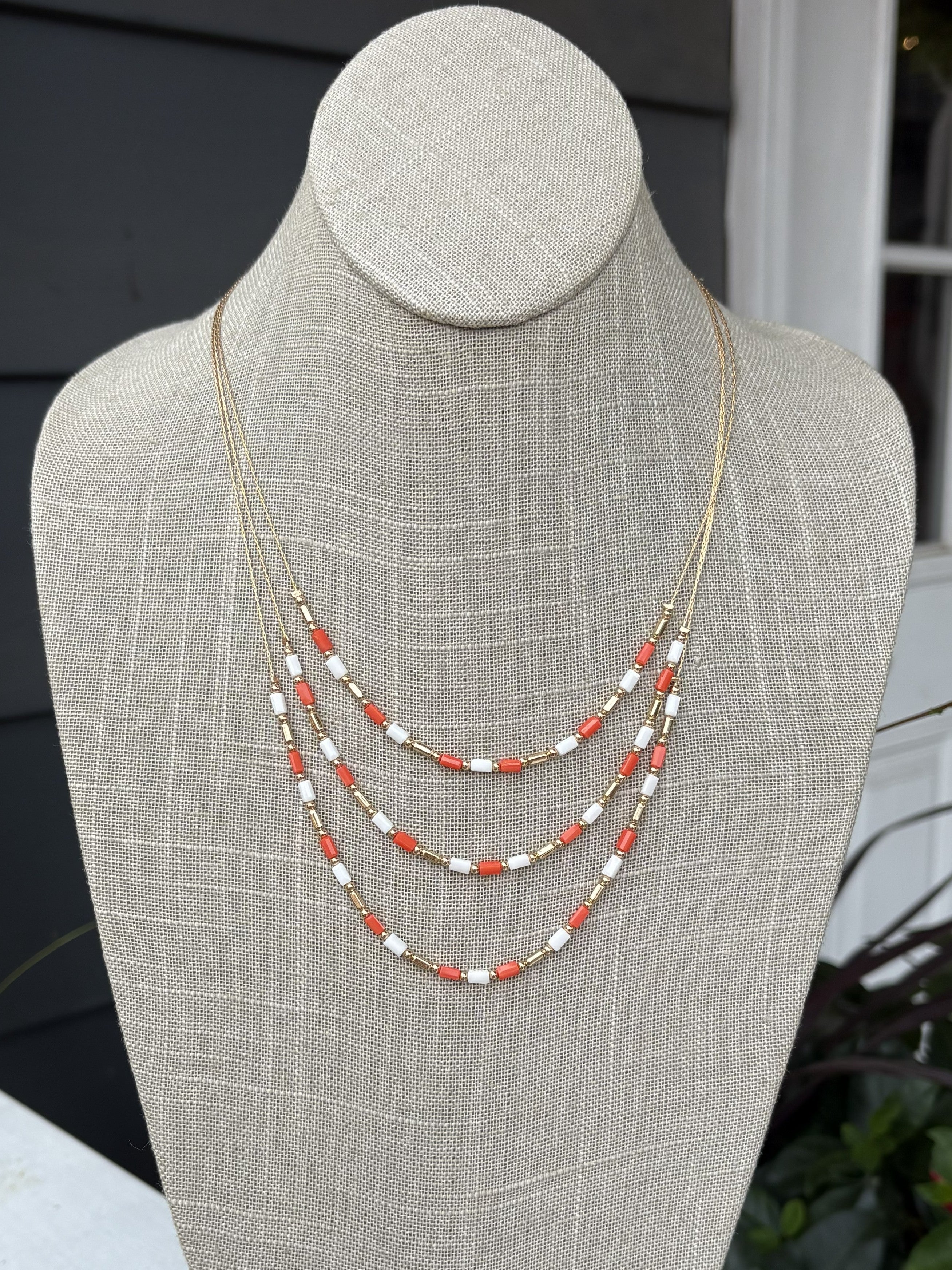 Showcase your team pride with the Duffie Triple Layer Game Day Necklace. This eye-catching layered piece features three tiers of vibrant colors designed to turn heads at the stadium or anywhere you go. The elegant construction balances bold team spirit with refined style, making it the perfect accessory for game day celebrations and beyond.