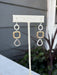Discover the perfect balance of style and versatility with these Mixed Metal Hammered Dangle Earrings. Crafted with a beautiful blend of gold and silver, the hand-hammered texture creates depth and character that catches light from every angle. The gentle dangle movement adds grace and fluidity to your look, whether you're dressing up for a special occasion or keeping it casual. These earrings seamlessly transition between any outfit, making them an indispensable addition to your jewelry collection for thos