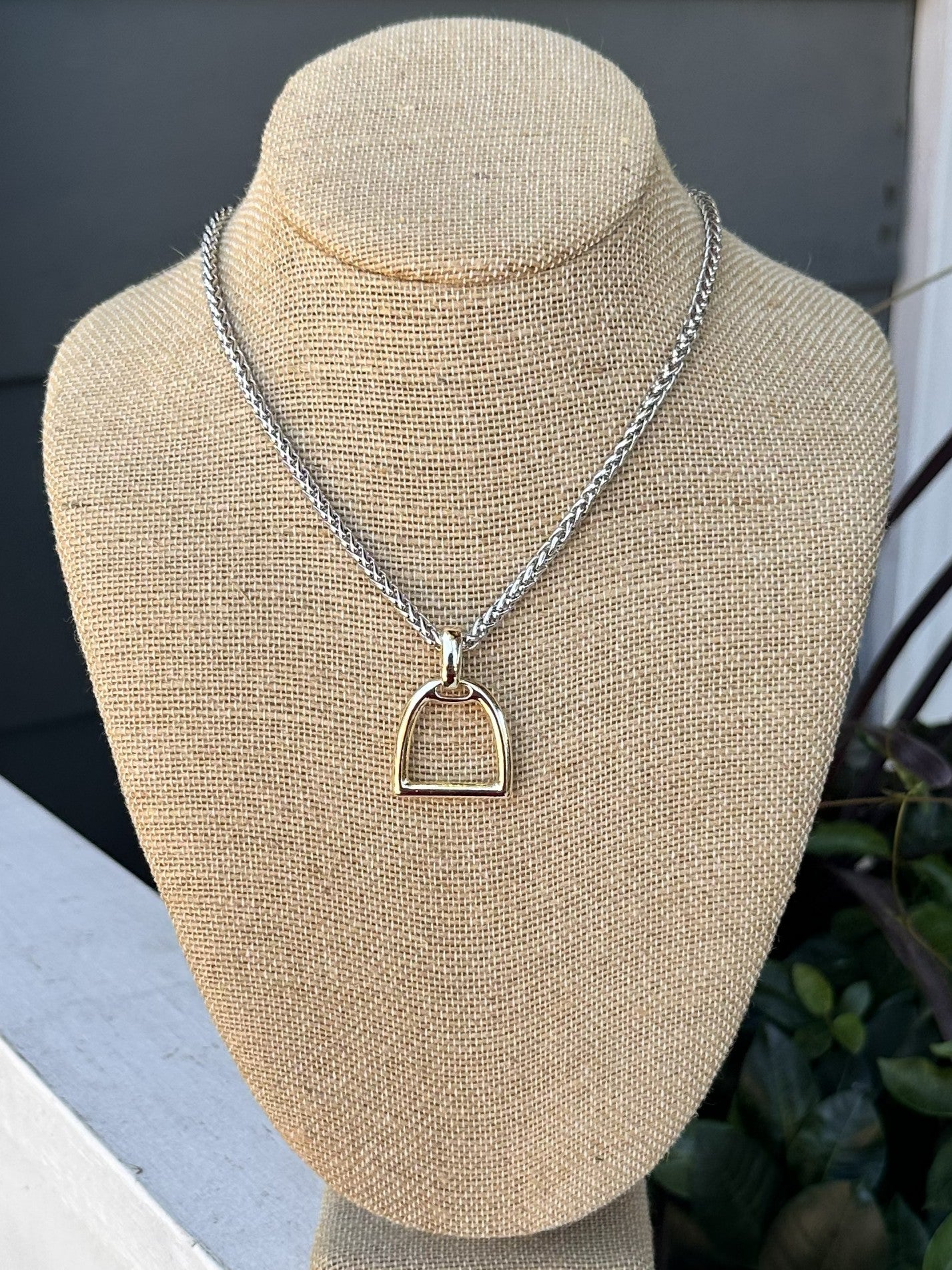 Add a touch of elegance to any outfit with our Mixed Metal Snaffle Bit Necklace! The snaffle bit design is so popular and fun. Great for the equestrian enthusiast. Perfect statement piece for any occasion – dressy or casual.

Approximate length: 17-19"