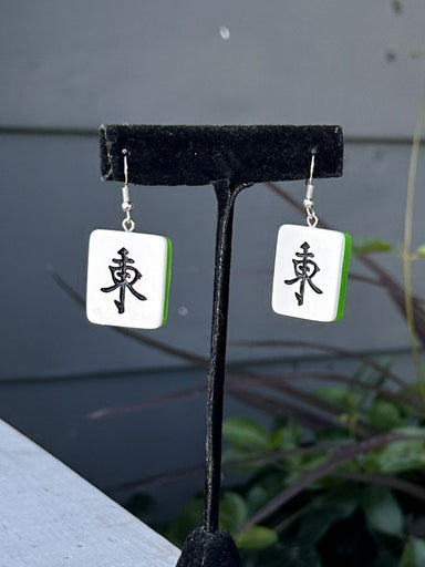 Show off your love for the game with these vibrant Mahjong Tiles Acrylic Earrings! Featuring iconic tile designs, these lightweight earrings bring playful charm to any outfit. Perfect for mahjong enthusiasts who want to celebrate their favorite pastime in style. Whether you're heading to game night or just want to spark conversations with fellow players, these fun earrings are a must-have for any mahjong lover's collection.

Size: 1" in length