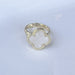 Elegant mother of pearl clover-shaped ring with adjustable sizing for a perfect fit. The lustrous pearl inlay catches the light beautifully, making it equally at home with casual everyday wear or dressed-up occasions. The timeless clover design adds a touch of sophistication to any jewelry collection.