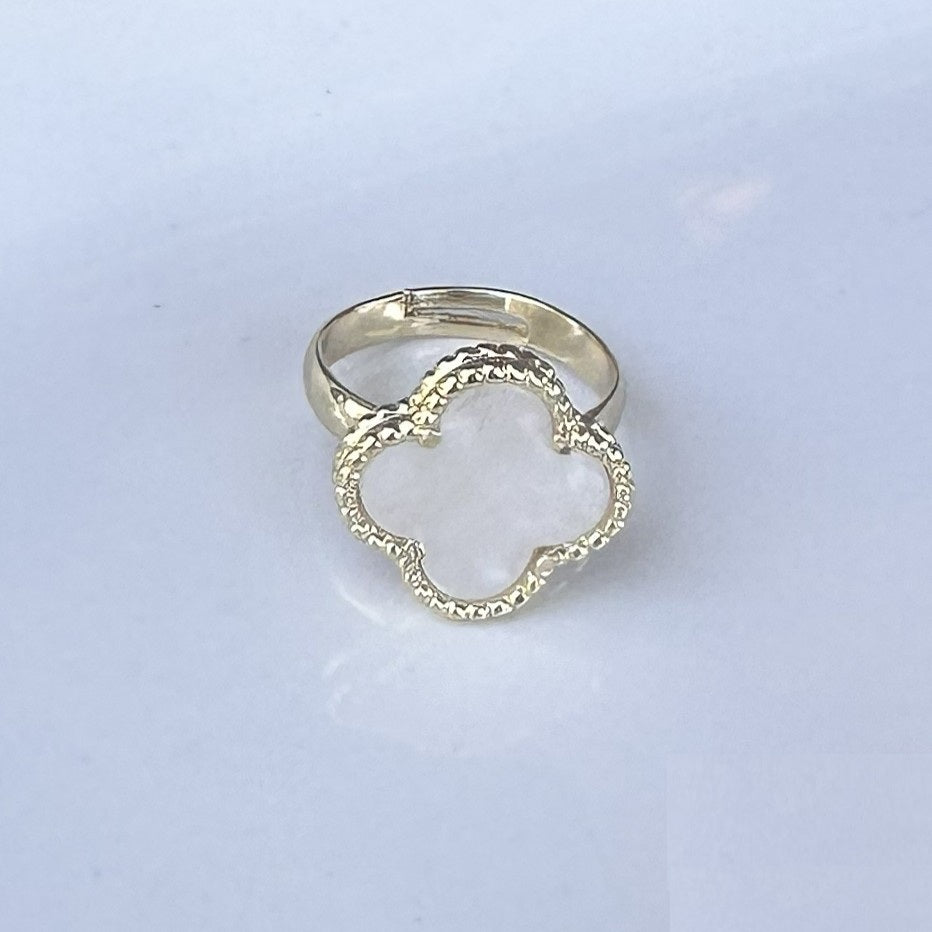 Elegant mother of pearl clover-shaped ring with adjustable sizing for a perfect fit. The lustrous pearl inlay catches the light beautifully, making it equally at home with casual everyday wear or dressed-up occasions. The timeless clover design adds a touch of sophistication to any jewelry collection.