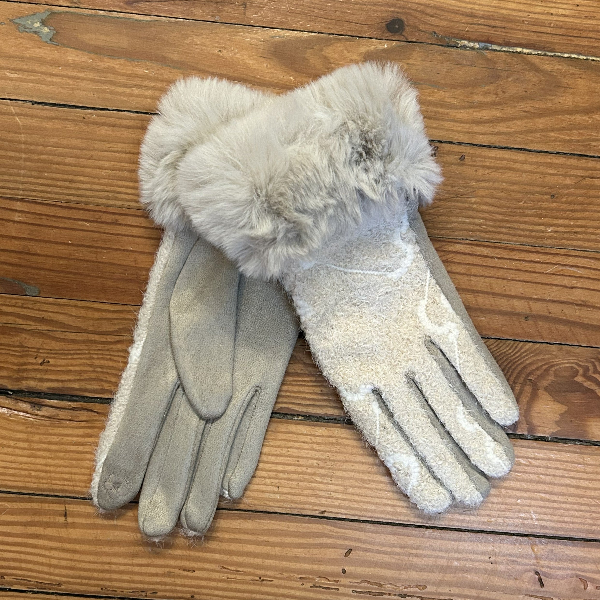 Warm, fashionable and comfortable, these gloves will keep you cozy and warm on the coldest of days! And, they are all smart phone friendly, so you don't have to remove your glove to use your phone or other touch screen devices. Gloves are one of our best sellers and we pride ourselves on having a great variety of colors and patterns. You will definitely find the perfect pair (or two!) for everyone on your gift list!

Glove are one size fits most and some run larger than others. Available in an array of diff