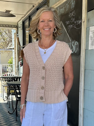 The Sherwood Button Up Sweater Vest is your go-to layer for effortless style. This lightweight knit in washed sand coral features subtle capped sleeves and a front button closure, making it ideal for layering over basics or dressing up casual looks. Its soft, breathable construction ensures comfort all day long, while the neutral tone pairs seamlessly with any outfit in your rotation.

Material: 89% Cotton / 11% Viscose

Care Instructions: Hand wash cold, dry flat