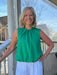 This versatile sleeveless top features a charming tie-gathered neckline and cinched waist for a flattering silhouette. Perfect for spring and summer occasions, it pairs effortlessly with jeans or casual pants for laid-back style. The soft rayon-polyester blend offers comfort and breathability. Ideal for St. Patrick's Day celebrations or everyday wear.&nbsp;

Material: 70% Rayon / 30% Polyester

Care Instructions: Gentle cool hand wash, dry flat