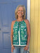 This charming sleeveless top combines feminine details with everyday versatility. The striking green and navy floral border print adds visual interest, while the tied spaghetti straps and front button closure create an effortlessly put-together look. Fully lined for comfort and structure, it pairs beautifully with jeans, skirts, or trousers. Perfect for spring and summer styling, this piece works equally well dressed down or elevated for special occasions.

Material: 70% Rayon / 30% Linen; Lining: 95% Polye