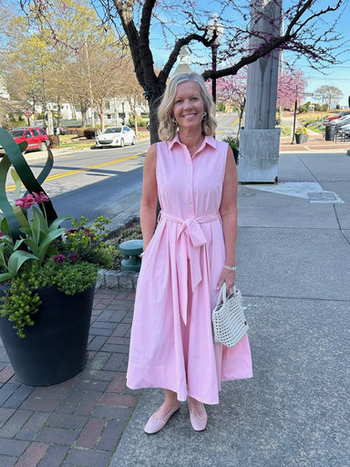 This versatile button-down midi dress combines timeless style with everyday practicality. The sleeveless silhouette and traditional collar create a polished look, while the flared skirt offers flattering movement and comfort. Functional side pockets add convenience without compromising elegance. Dress it up for special occasions like Easter or spring celebrations, or keep it casual for weekend wear. The button-front design allows easy layering with cardigans or jackets as seasons transition. You will love t