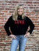 Cozy up in style with our "LOVE" Long Sleeve Sweater! The black background with bold red lettering is so fun, while the crew ribbed neck and cuffs add a touch of elegance. The soft and cozy fabric will keep you warm, and the split ribbed waist adds a modern edge.&nbsp;

Material: 100% Cotton

Care Instructions: Hand wash cold, line dry