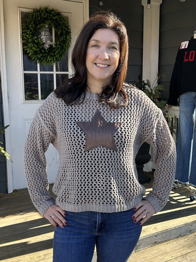 Wrap yourself in cozy comfort with our Star Accented Crocheted Sweater! This lovely sweater features a beautiful crocheted design and is so very soft to the touch. The star applique adds a touch of fun.&nbsp;

Material: 100% Polyester

Care Instructions: Hand wash cold, line dry