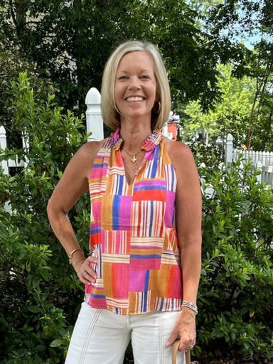 Enhance your wardrobe with this vibrant sleeveless top featuring a striking multi-colored block design. The V-neckline and ruffled collar add feminine charm, while the lined construction ensures a polished fit. Versatile enough for both dressy occasions and casual outings, this piece showcases a beautiful blend of colors that brings energy and style to any look.

Material: 98% Polyester / 2% Spandex

Care Instructions: Gentle cool hand wash cold, dry flat