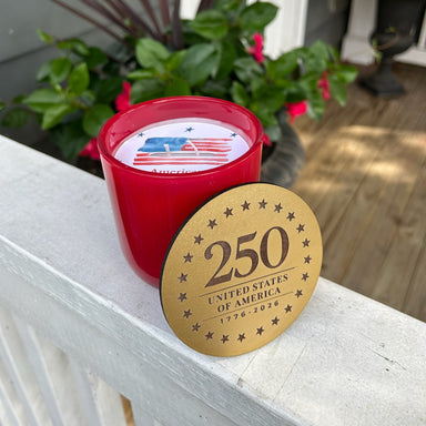 Celebrate America's milestone with these stunning 250th United States Commemorative Candles. Each dual-wick candle features a luxurious gold lid and comes in patriotic red or blue, making it the perfect keepsake for this historic occasion. The beautiful container is designed to be treasured long after the candle burns down, serving as a lasting reminder of this momentous anniversary. Ideal for collectors, patriots, and those who appreciate meaningful home décor.