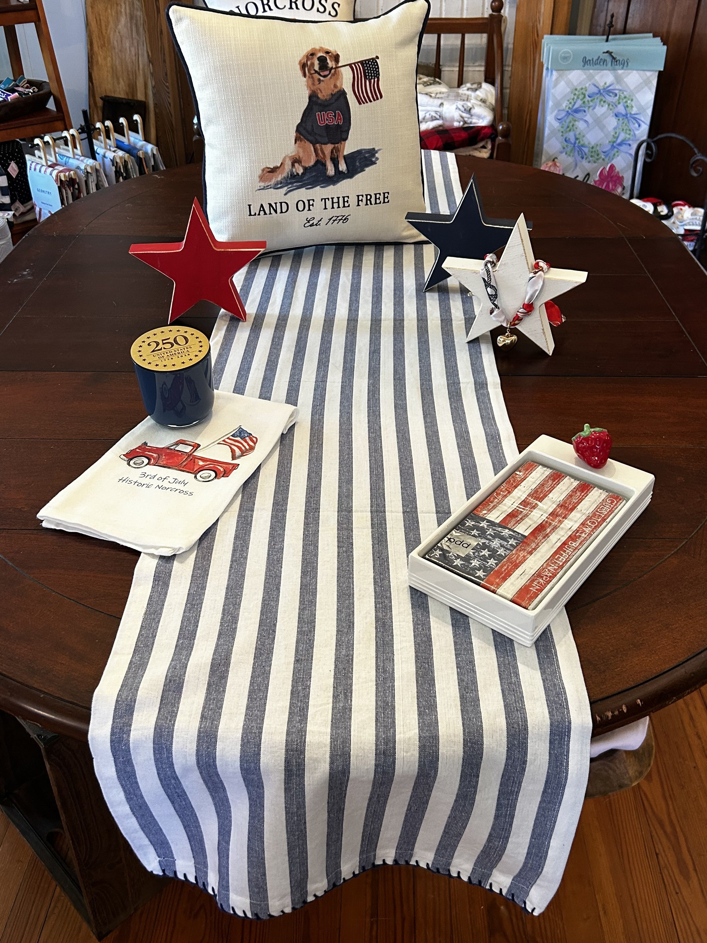 Crisp blue and white stripes bring timeless appeal to any space. This lightweight runner works beautifully for patriotic displays, spring gatherings, and summer entertaining. The whipstitched edges add refined detail and durability. Perfect for entryways, kitchens, or seasonal décor that celebrates classic American style.

Dimensions: 16 x 72 Oblong

Material: 100% Cotton

Care Instructions: Cold Hand Wash, Hang Dry, Medium Iron