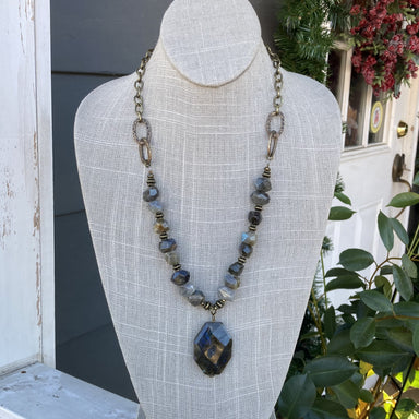 Unique and stunning - our Antique Gold and Stone Necklace is sure to make a statement. Crafted from an antique gold chain with beautiful stone beading, and featuring a stunning stone pendant, this necklace is perfect for adding a touch of class to any look.  Length is approximately 24"