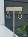Elegant gold drop earrings that effortlessly transition from day to night. These delicate dangles feature a timeless design that complements any outfit—whether you're dressing up for a special occasion or keeping it casual.