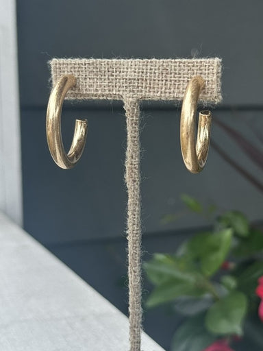 Sleek tube-shaped hoops that bring timeless elegance to any look. Available in warm gold or cool silver finishes, these earrings feature secure post backs for comfortable all-day wear. The smooth, polished design catches light beautifully, making them perfect for both everyday styling and special occasions. A versatile staple that pairs effortlessly with any outfit.