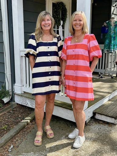 This charming spring dress combines playful style with everyday comfort. Featuring a bold stripe design, it's impossible to miss. The square neckline and puffed sleeves add a sweet, feminine touch, while the button-up front makes getting dressed effortless. Cut as a short dress with a lined interior for a polished fit, it's the perfect piece for creating those Instagram-worthy spring looks. Whether you're heading to brunch or a casual outing, this dress brings instant joy to your wardrobe.

Carolee and Barb